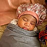 Mai is registered to the contest to win money with this photo: baby, blanket, bonnet, calm, child, closeup, cute, fabric, face, headwear, indoors, infant, peaceful, person, pink, resting, serene, sleeping, soft, wrapped