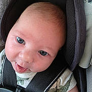 Theodore joined the competition — help win amazing prizes! baby, infant, car_seat, headrest, smile, face, child, seatbelt, safety, clothing, closeup, cute, skin, eyes, mouth, tongue, hair, expression, indoors, person