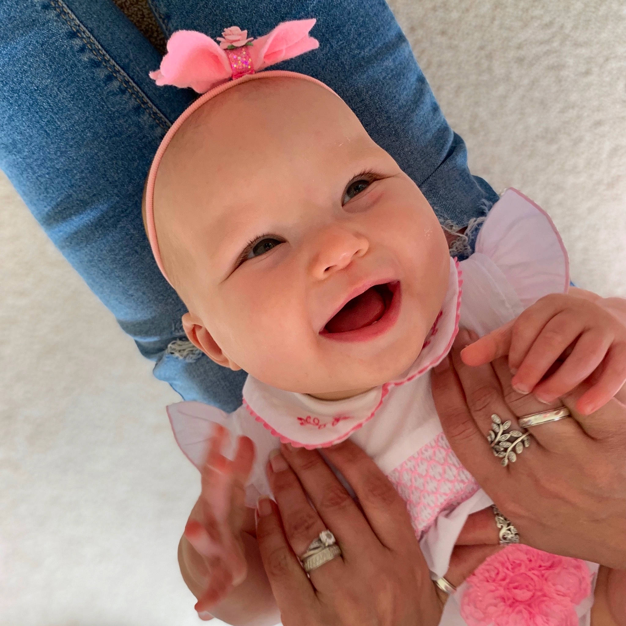 Lacie joined the competition — help win amazing prizes! baby, baby_making_funny_faces, cheek, child, chin, face, facial_expression, fashion_accessory, finger, gesture, hair_accessory, hand, head, headgear, lip, mouth, nose, person, pink, skin