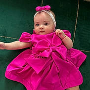 Evelinne joined the competition — help win amazing prizes! baby, child, pink_dress, headband, bow, cushion, green_cushion, infant, portrait, cute, lying_down, indoor, soft_fabric, small_hand, baby_face, baby_clothing, relaxed, looking_at_camera, child_fashion, adorable