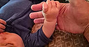 Theodore joined the competition — help win amazing prizes! adult_hand, baby, bed, blanket, blue_outfit, child, closeup, clothing, comfort, cuddle, grip, hand, person, plush_toy, rest, skin, sleeping, soft_texture, toddler, warm
