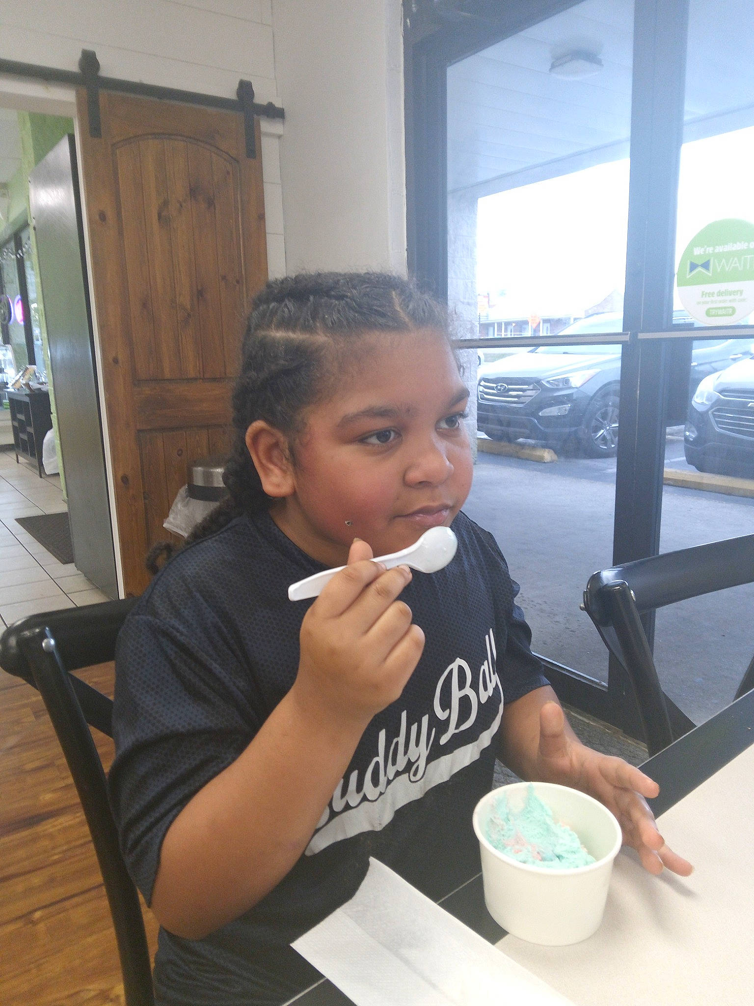 Amellia is registered to the contest to win money with this photo: bowl, breakfast, car, chair, child, comfort_food, cooking, cuisine, dish, drink, drinkware, food, meal, person, t_shirt, table, tableware, thumb, tire, toddler