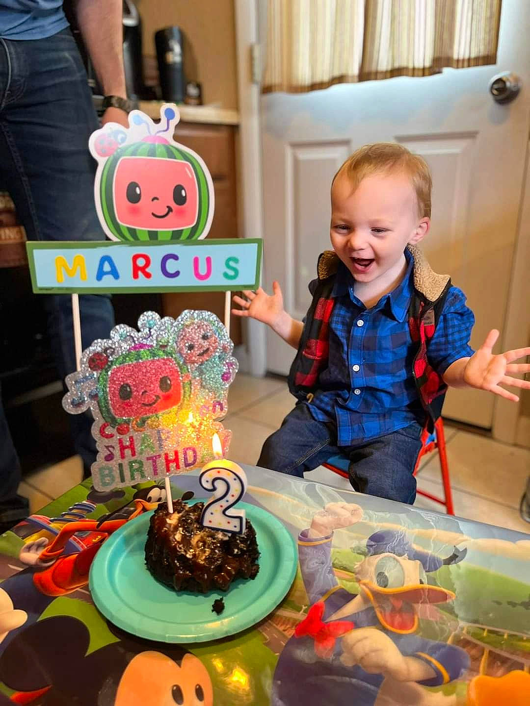 Marcus is registered to the contest to win money with this photo: baked_goods, birthday, birthday_cake, birthday_candle, cake, cake_decorating, cake_decorating_supply, chair, cuisine, event, food, green, orange, person, plate, smile, sugar_cake, sugar_paste, table, tableware