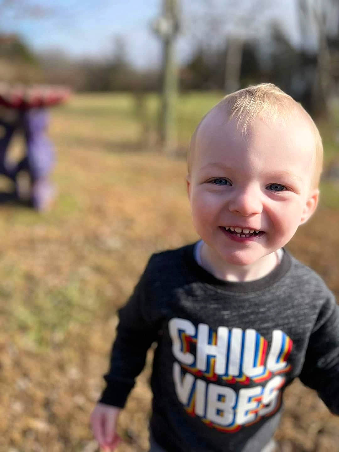 Marcus is registered to the contest to win money with this photo: baby, baby_toddler_clothing, child, cool, grass, happy, head, human_body, iris, joy, leisure, nose, people_in_nature, person, plant, recreation, skin, sleeve, smile, t_shirt