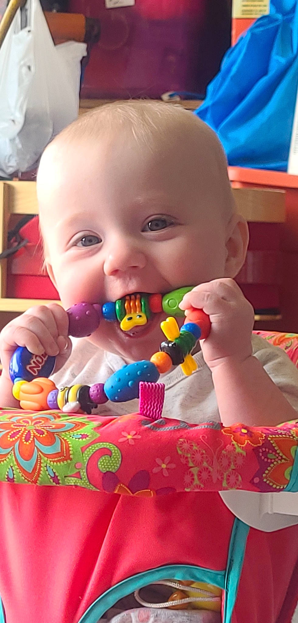 Iris is registered to the contest to win money with this photo: baby, baby_playing_with_toys, baby_products, baby_toddler_clothing, baby_toys, cheek, child, confectionery, event, fun, happy, head, nose, person, play, room, sitting, smile, sweetness, toddler