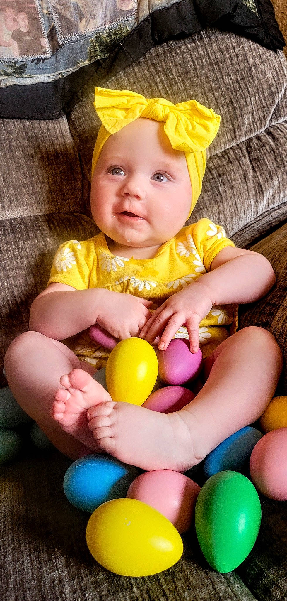 Iris is registered to the contest to win money with this photo: baby, baby_toddler_clothing, cheek, eye, face, finger, green, hand, happy, head, iris, people, person, photograph, pink, purple, skin, smile, toddler, white