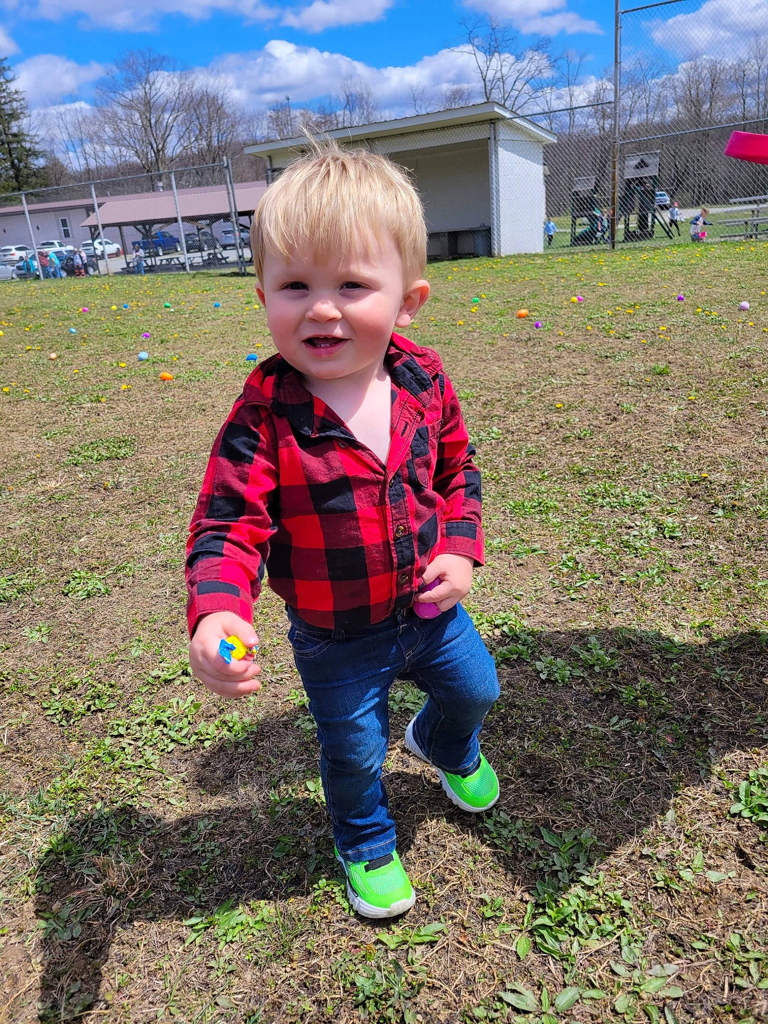 Eli joined the competition — help win amazing prizes! baby_toddler_clothing, blue, child, cloud, fun, grass, grass_family, grassland, human_settlement, lawn, pattern, people_in_nature, person, plaid, plant, public_space, sky, standing, tartan, toddler