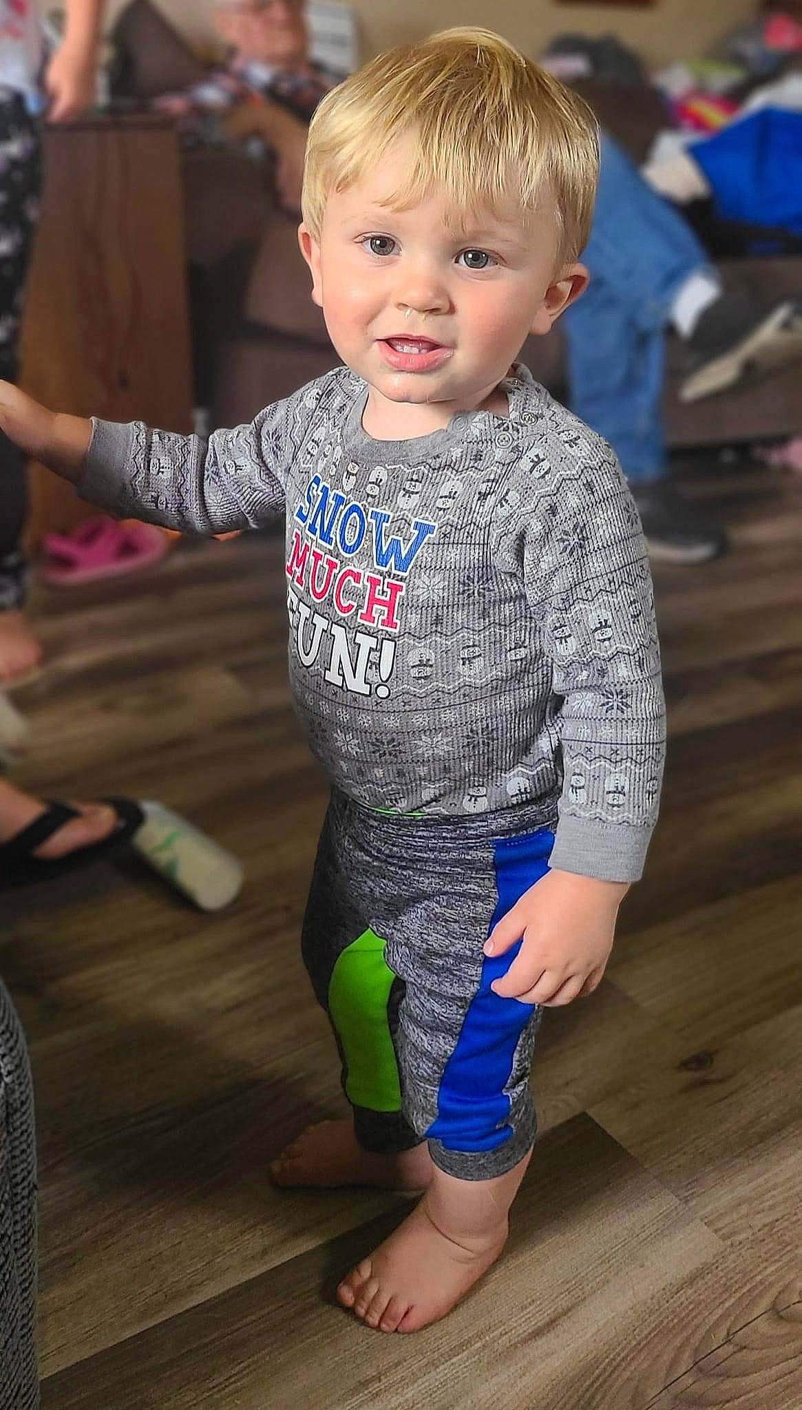 Eli is registered to the contest to win money with this photo: baby_toddler_clothing, blue, child, face, floor, flooring, fun, hairstyle, happy, head, joint, leg, leisure, people, person, shoulder, skin, sleeve, smile, standing