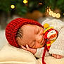 Kaiisaac joined the competition — help win amazing prizes! baby, newborn, sleeping, red_hat, knitwear, toy, monkey_toy, bokeh, blurred_background, cozy, cute, infant, pillow, soft, hand, face, peaceful, warm_lighting, portrait, indoors
