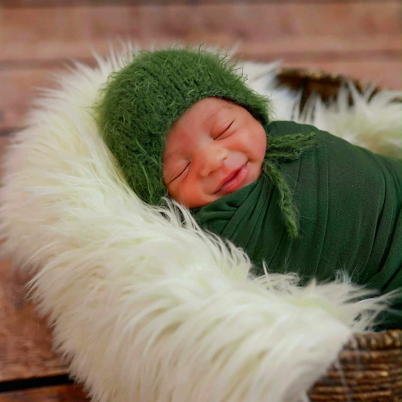 Kaiisaac joined the competition — help win amazing prizes! baby, basket, blanket, child, cozy, cute, fur, green_hat, indoors, infant, newborn, peaceful, portrait, resting, sleeping, smile, soft_texture, swaddled, wood_floor, wrapped