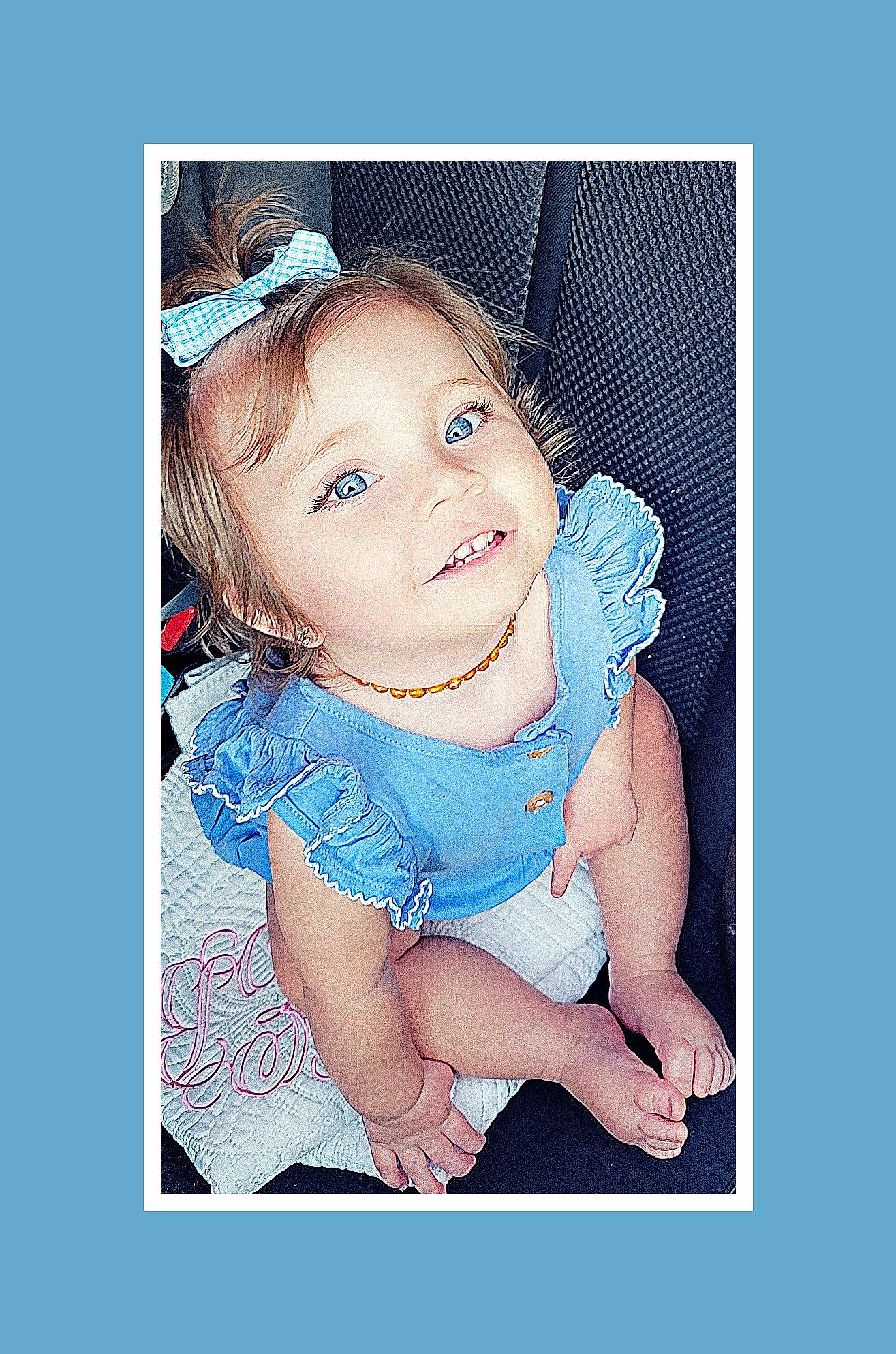 Bennett is registered to the contest to win money with this photo: aqua, baby, baby_toddler_clothing, cheek, child, electric_blue, font, happy, joy, magenta, pattern, peach, person, portrait_photography, product, sitting, sleeve, toddler, wrist