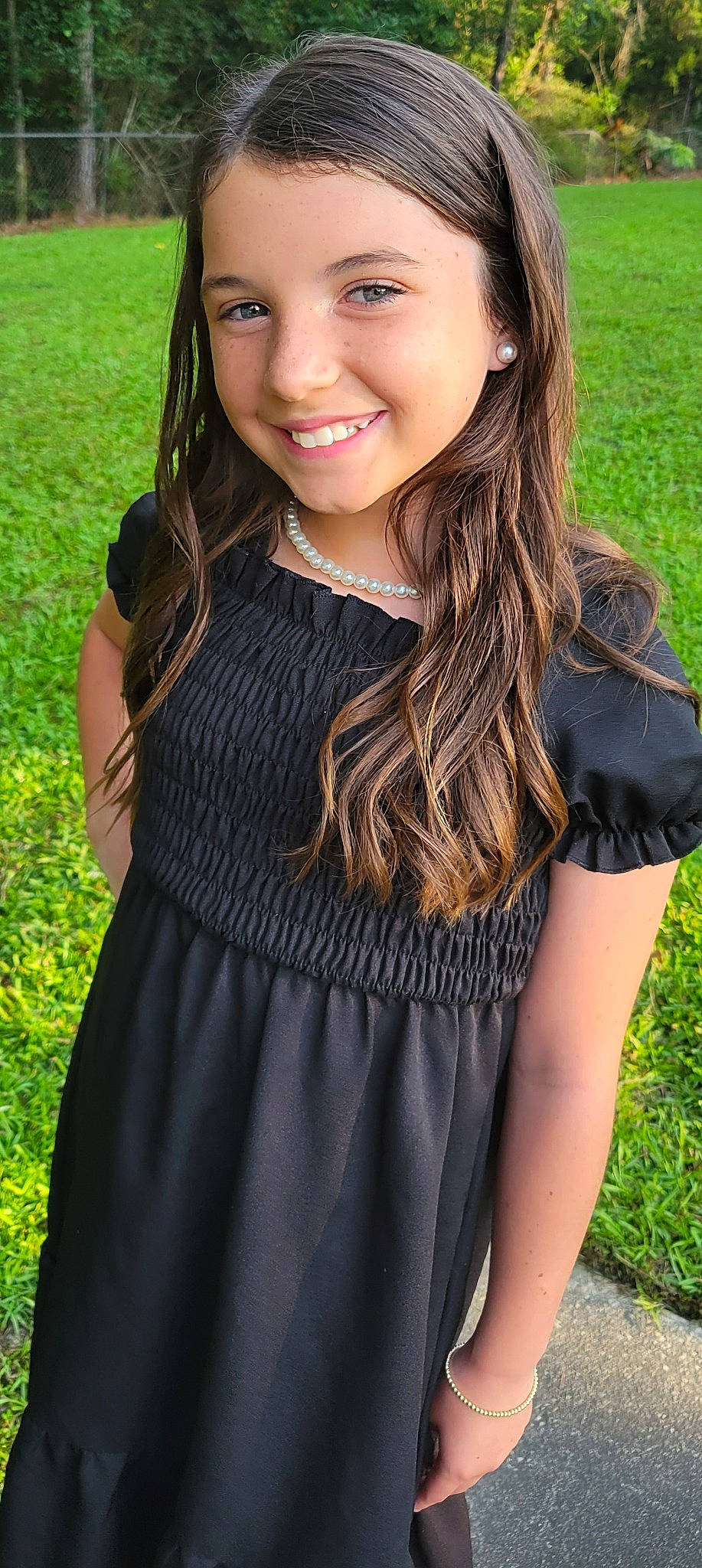 Mckinley is registered to the contest to win money with this photo: black_hair, blond, brown_hair, day_dress, facial_expression, flash_photography, grass, green, hairstyle, happy, jewellery, joy, layered_hair, lip, long_hair, neck, pattern, person, shoulder, sleeve