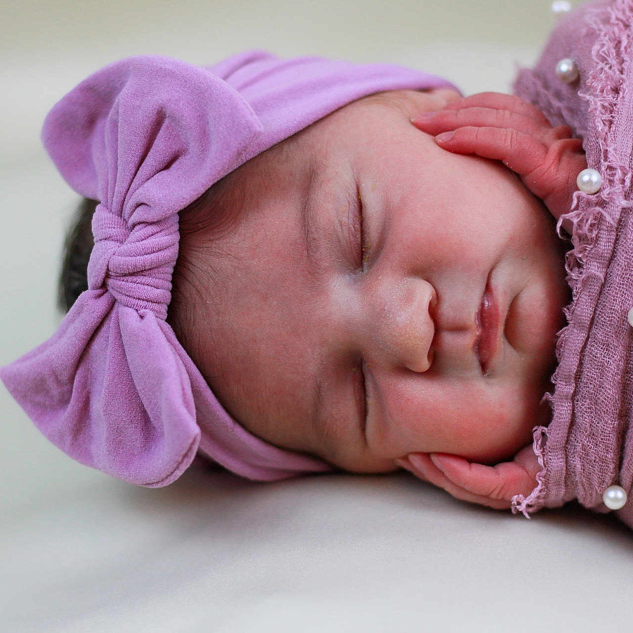 Raylee joined the competition — help win amazing prizes! arm, baby, baby_sleeping, baby_toddler_clothing, bedtime, cheek, child, comfort, eyelash, fashion_accessory, hair_accessory, happy, headgear, linens, lip, magenta, pink, skin, sleeve, toddler