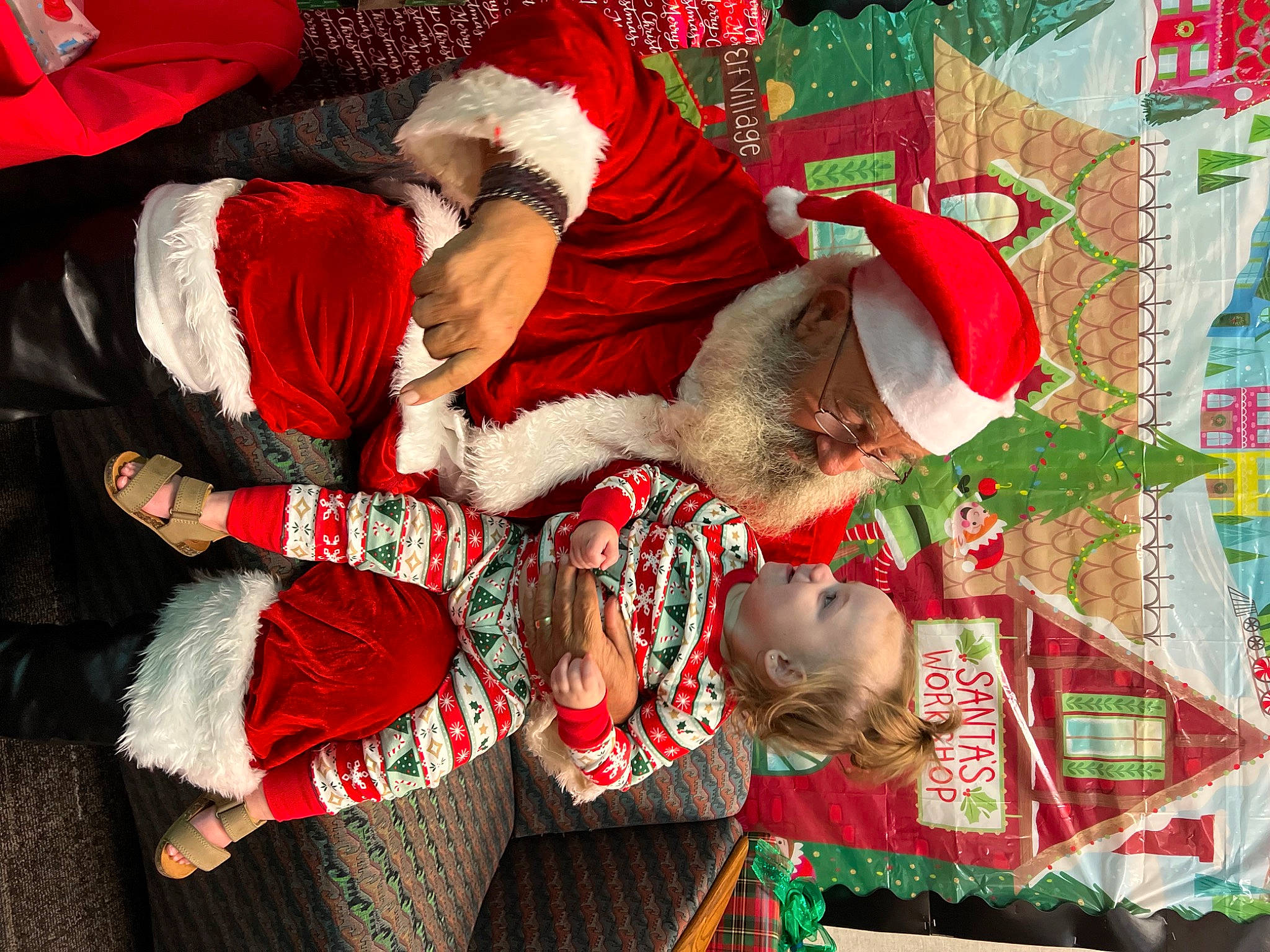 Brynlee is registered to the contest to win money with this photo: carmine, christmas, christmas_decoration, christmas_eve, christmas_ornament, costume_hat, event, fictional_character, fur, hat, holiday, holiday_ornament, interior_design, pattern, person, plant, red, room, santa_claus, tradition