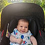 baby, car_seat, child, clothing, cute, daylight, greenery, happy, infant, nature, outdoor, person, portrait, relaxing, seat, smiling, summer, sunlight, toddler, trees