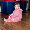toddler, child, pink_clothing, toy, floor, wooden_floor, indoor, storage_bin, baby_gate, curious, sitting, person, young_child, play, home, casual, cute, indoors, looking, flooring