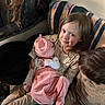 Aurora joined the competition — help win amazing prizes! child, baby, couch, blanket, smile, indoor, clothing, person, holding, seated, infant, toddler, home, family, cute, portrait, cozy, warm, sibling, relaxing