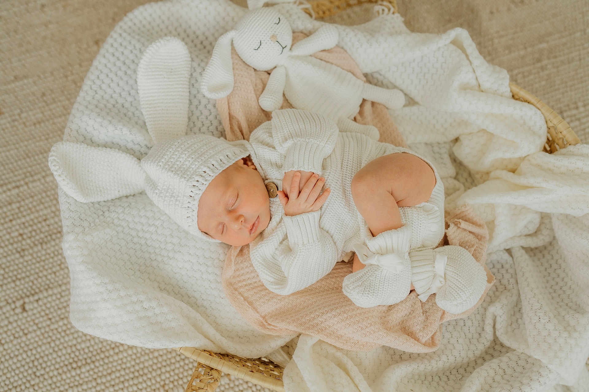 Ella is registered to the contest to win money with this photo: baby, sleeping, knit_hat, knit_outfit, bunny_ears, blanket, soft_toys, basket, cozy, newborn, infant, cute, resting, indoors, warm, fabric, handmade, sleep, child, knitted