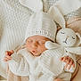 Ella is registered to the contest to win money with this photo: baby, sleeping, knit_hat, knit_toy, blanket, soft_texture, cozy, infant, cute, child, knit_clothing, toy_bunny, resting, peaceful, indoors, portrait, newborn, wrapped, warm, cute_hand