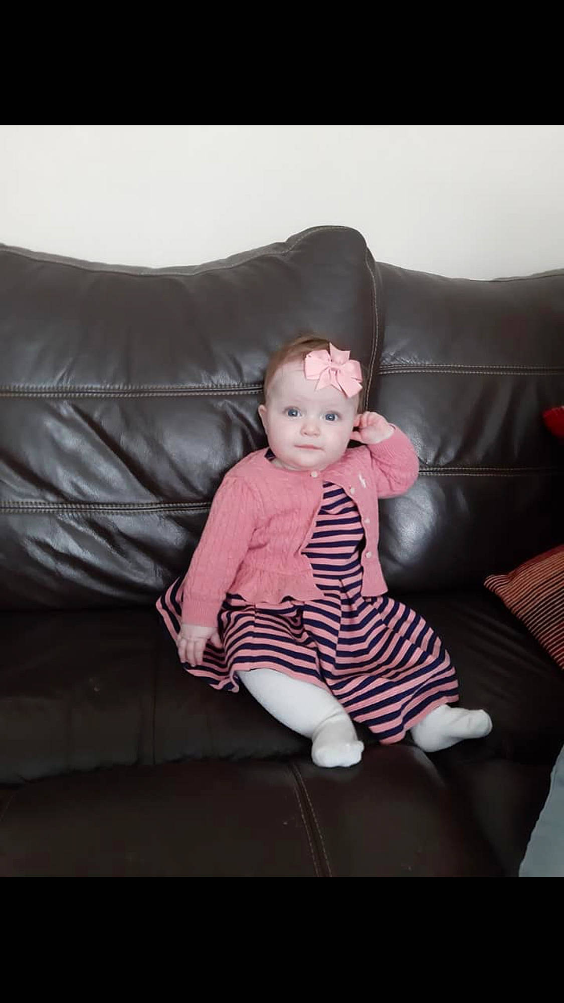 Laney joined the competition — help win amazing prizes! arm, baby, cheek, child, comfort, couch, face, finger, furniture, head, lap, leg, person, photograph, pink, sitting, skin, smile, toddler