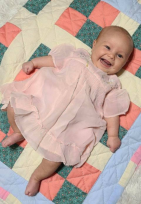 Lakelyn joined the competition — help win amazing prizes! baby, baby_products, baby_toddler_clothing, child, comfort, finger, flooring, fun, happy, human_leg, linens, magenta, pattern, person, pink, sitting, skin, sleeve, smile, thigh