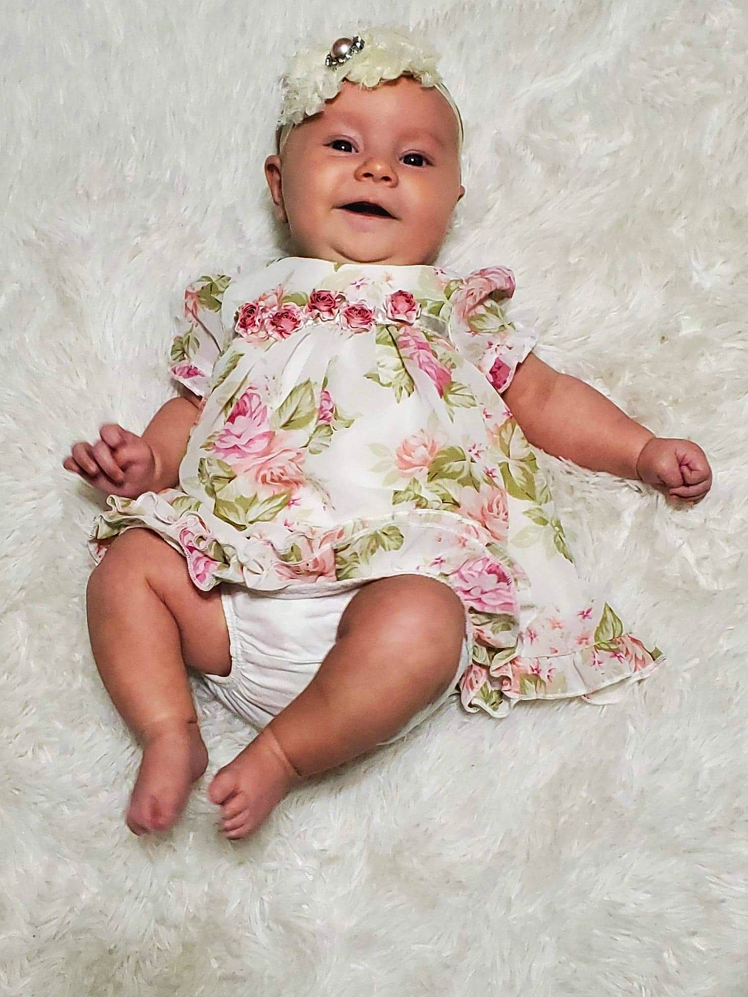 Lakelyn joined the competition — help win amazing prizes! arm, baby, baby_toddler_clothing, cheek, day_dress, dress, eye, face, facial_expression, finger, hand, happy, head, headgear, headwear, iris, organ, person, pink, skin