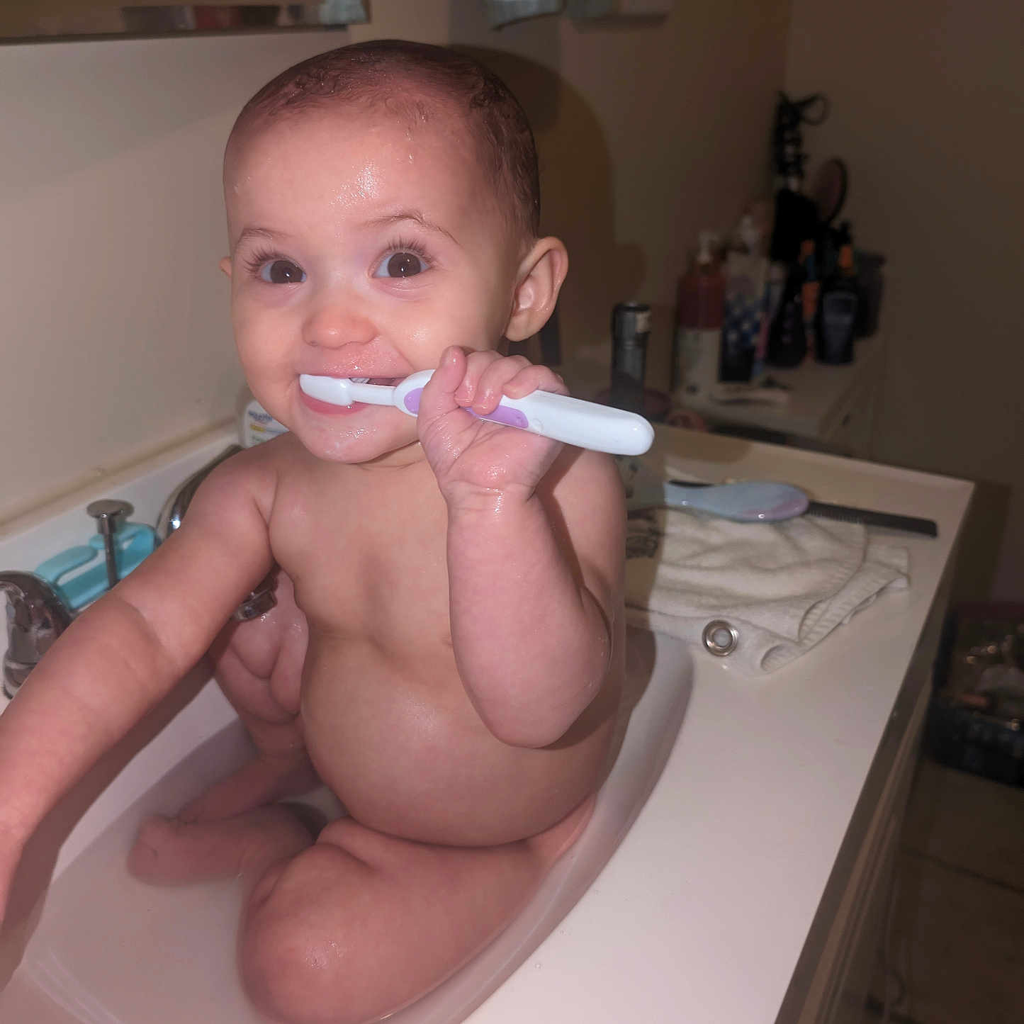 Khaliyah is registered to the contest to win money with this photo: baby, basin, bathing, bathtub, bodypart, brush, cutlery, device, finger, hand, indoors, mouth, person, sink, spoon, teeth, tool, toothbrush, toothpaste, tub