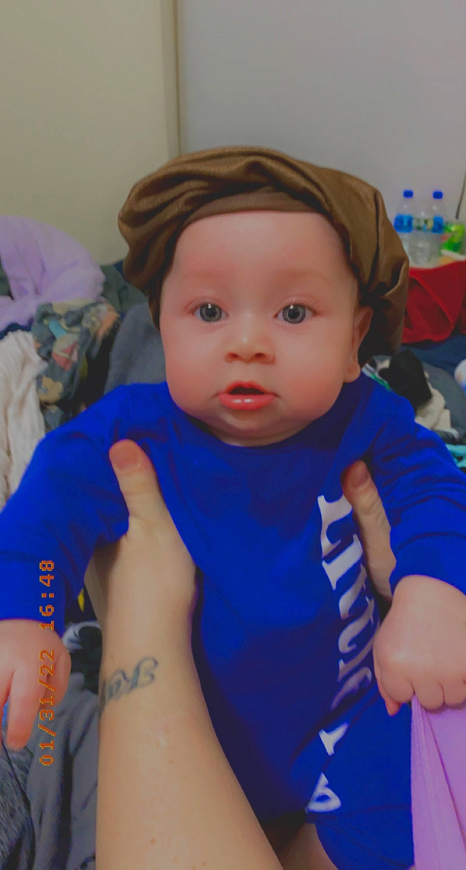 Kash is registered to the contest to win money with this photo: abdomen, baby, baby_toddler_clothing, blue, cheek, child, chin, electric_blue, eyelash, finger, hand, iris, nail, nose, person, skin, sleeve, t_shirt, thumb, toddler