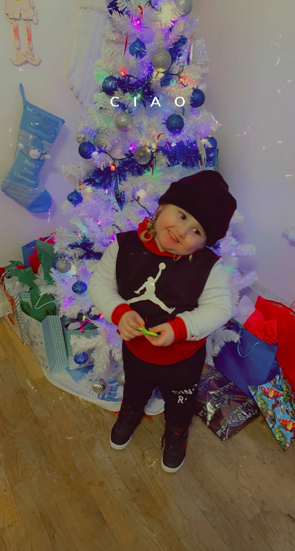 Kayden is registered to the contest to win money with this photo: christmas, christmas_decoration, christmas_eve, christmas_ornament, christmas_tree, design, electric_blue, event, fun, happy, headwear, holiday, holiday_ornament, joy, lap, magenta, ornament, party_supply, person, plant