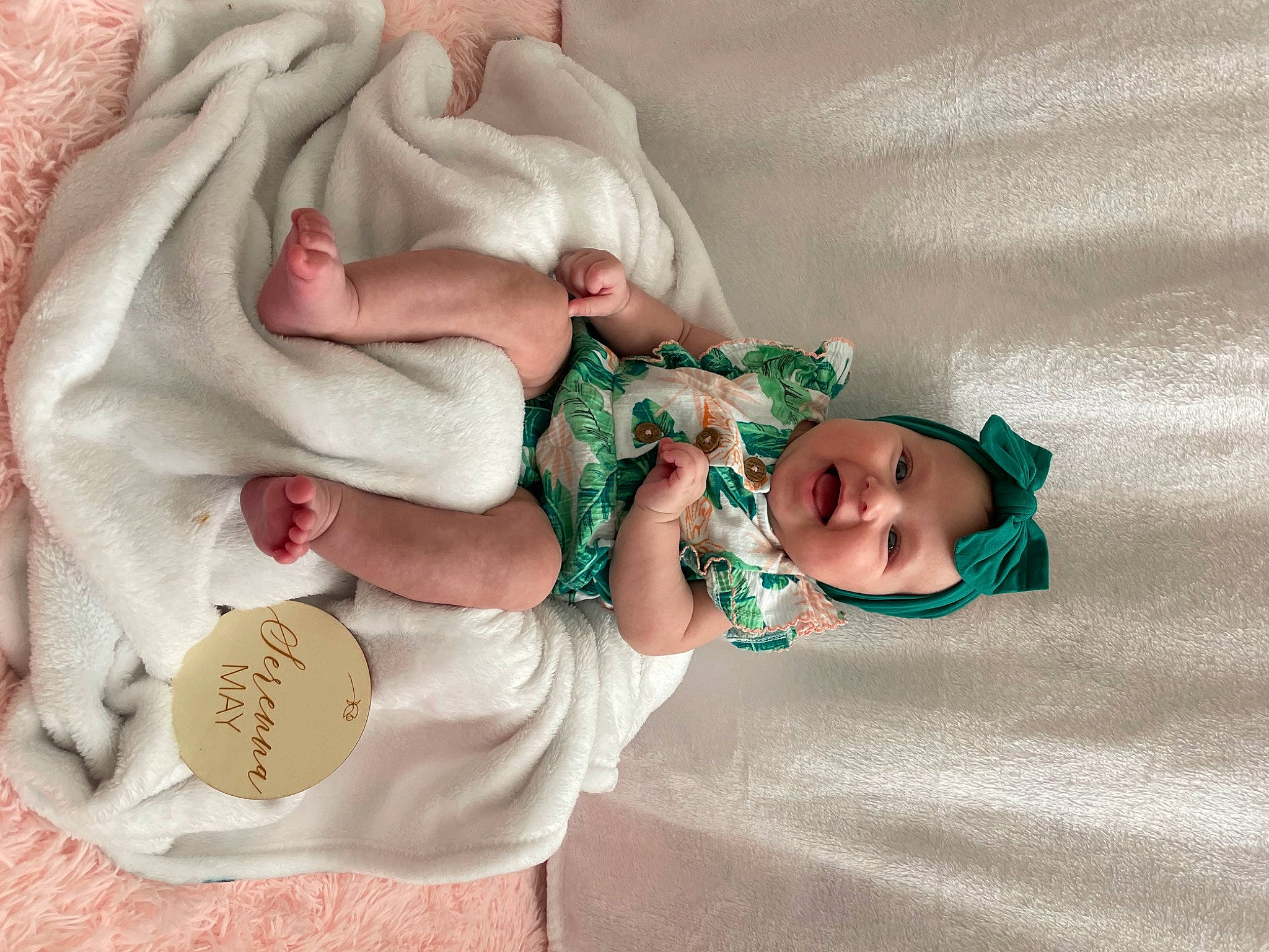 Serenna is registered to the contest to win money with this photo: baby, baby_products, baby_sleeping, baby_toddler_clothing, child, comfort, fashion_accessory, finger, hand, headgear, headwear, human_body, linens, pattern, person, pink, room, skin, sleeve, sock