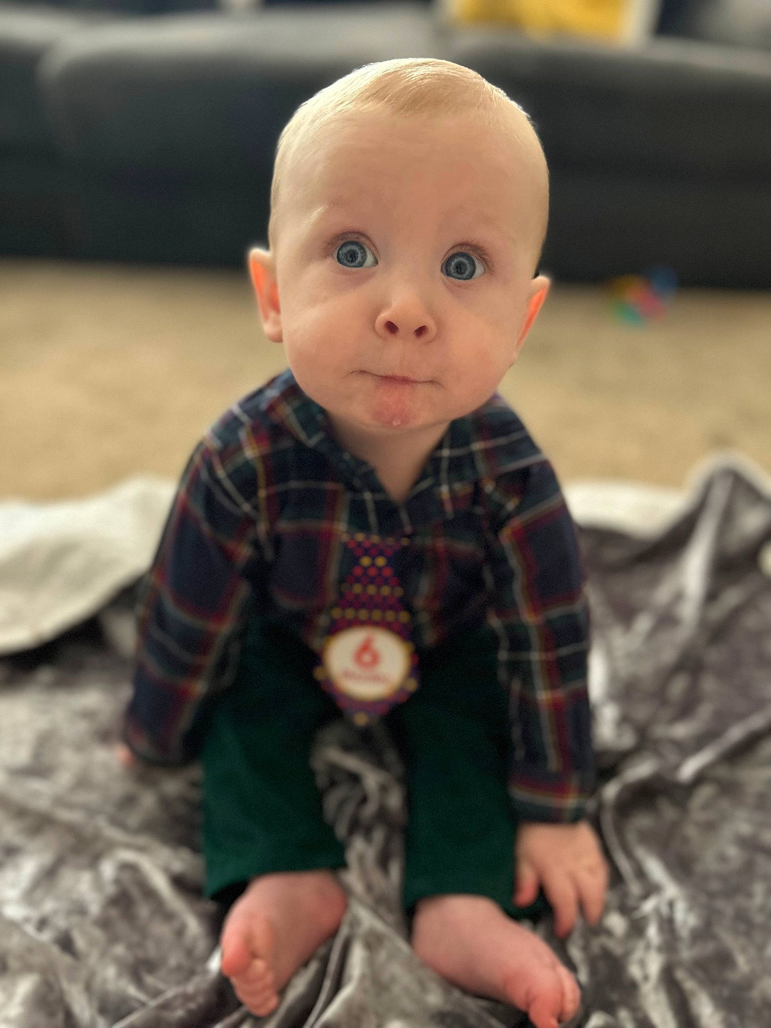 Isaiah joined the competition — help win amazing prizes! arm, baby_toys, child, doll, finger, flooring, fur, linens, pattern, person, plaid, play, sitting, sleeve, stuffed_toy, surprise, tartan, textile, toddler, toy