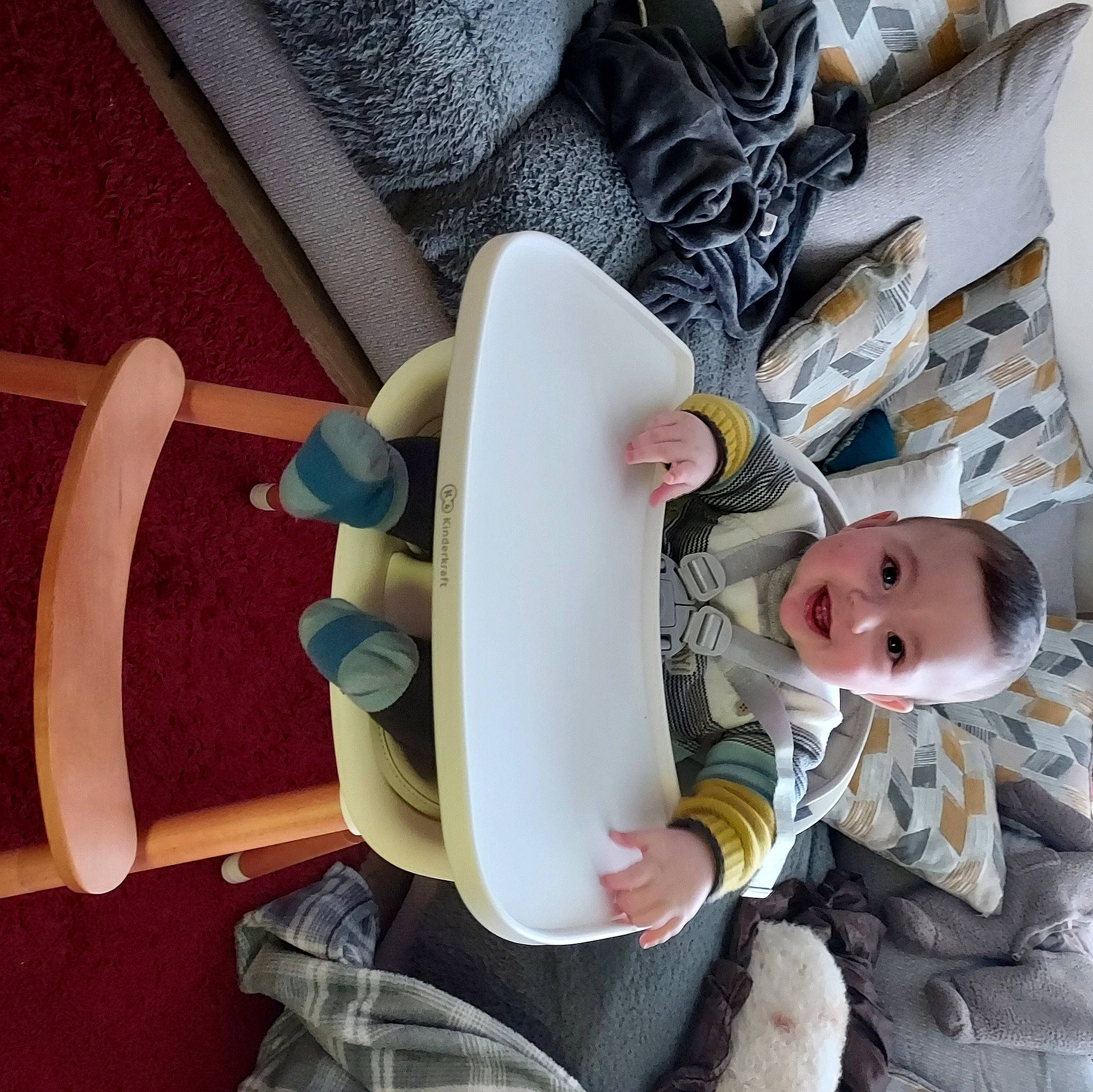 Jai is registered to the contest to win money with this photo: arm, baby, baby_carriage, baby_products, baby_safety, baby_toddler_clothing, carmine, chair, child, comfort, human_leg, leg, linens, pattern, person, room, sitting, thigh, toddler, tree