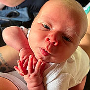 Maverick joined the competition — help win amazing prizes! baby, newborn, infant, face, hand, skin, person, closeup, expression, curious, cute, white_clothing, human, child, resting, soft_light, portrait, indoors, skin_texture, arm