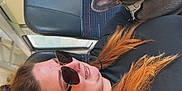 Blue joined the competition — help win amazing prizes! woman, dog, french_bulldog, sunglasses, bus, seat, pet, travel, portrait, casual, leisure, red_hair, earrings, black_clothing, animal, companion, indoor, resting, cute, friendly