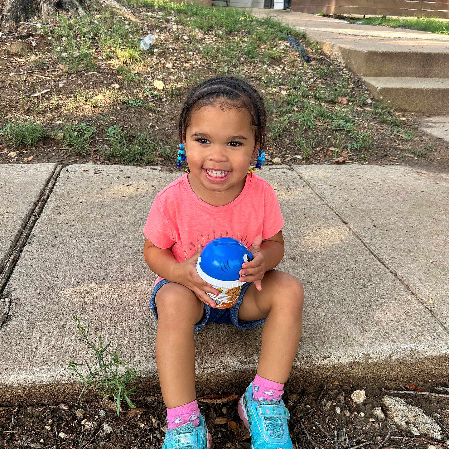 Azephaniah joined the competition — help win amazing prizes! backyard, child, clothing, face, female, footwear, girl, head, nature, outdoors, path, person, photography, portrait, shoe, shorts, sitting, soil, summer, yard