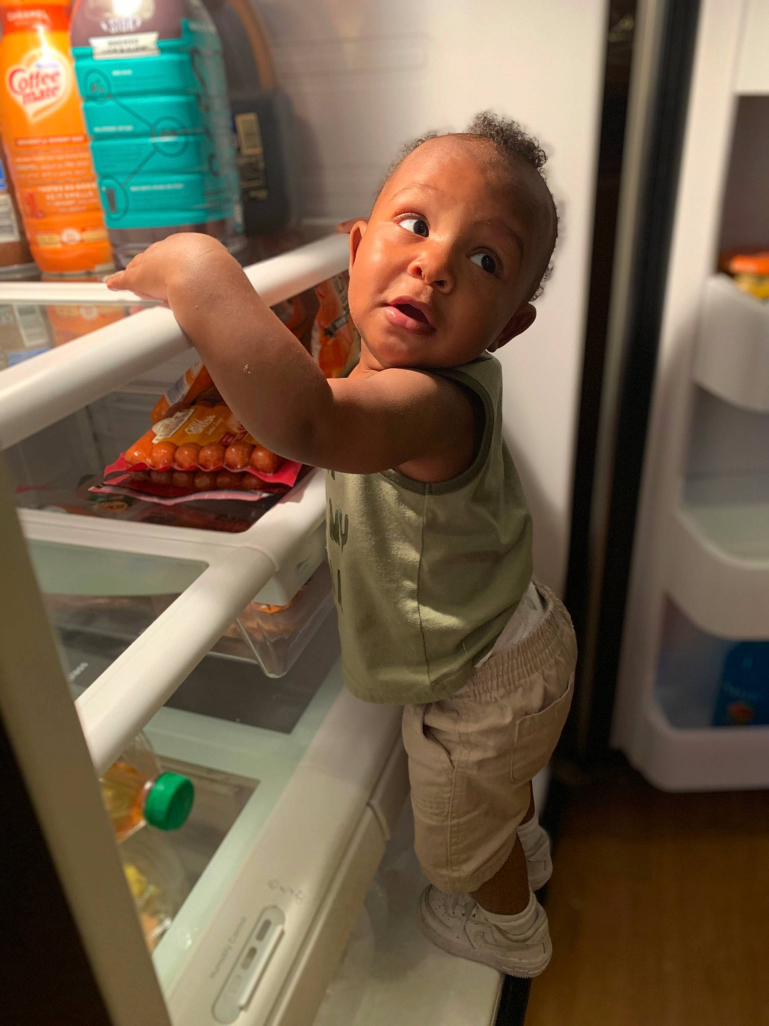 Kamari joined the competition — help win amazing prizes! baby, baby_toddler_clothing, child, elbow, flooring, fun, gas, joint, person, plastic_bottle, play, product, refrigerator, room, service, smile, standing, surprise, t_shirt, thumb