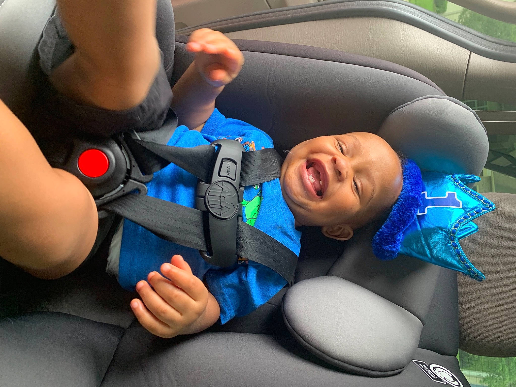 Kamari is registered to the contest to win money with this photo: auto_part, automotive_design, azure, car_seat, child, comfort, electric_blue, facial_expression, finger, flash_photography, fun, gesture, hand, happy, interaction, leisure, mouth, person, smile, thumb