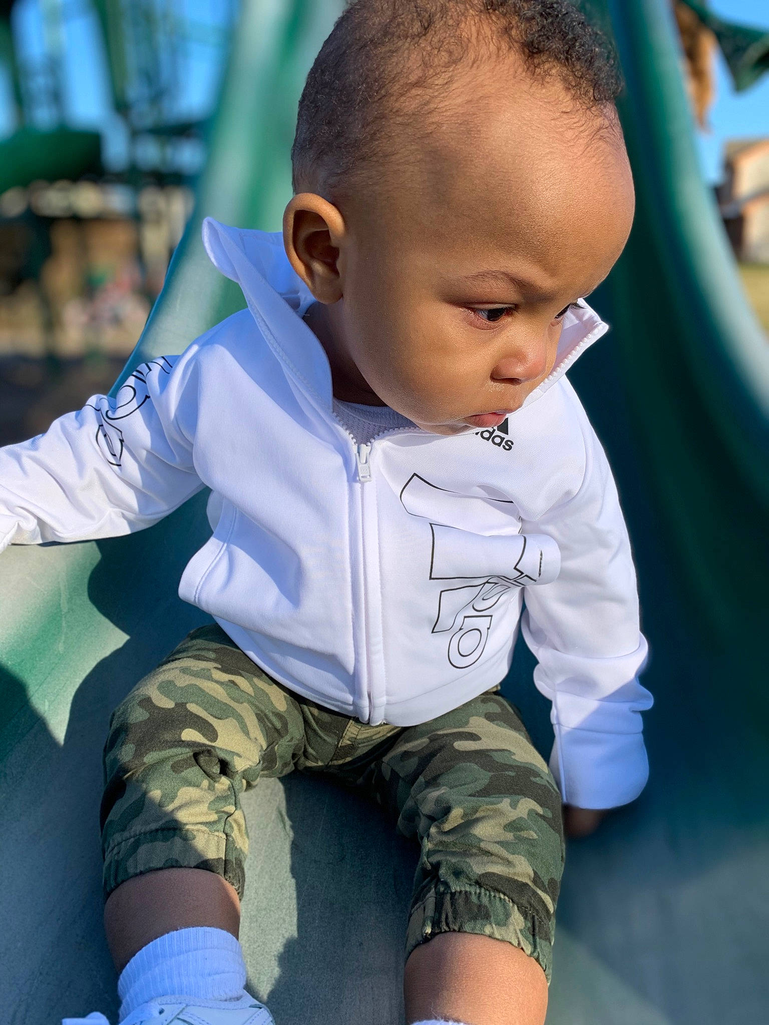 Kamari is registered to the contest to win money with this photo: baby, baby_toddler_clothing, beauty, blue, child, chin, elbow, electric_blue, fun, grass, happy, knee, leg, leisure, neck, person, playground, skin, sleeve, thigh