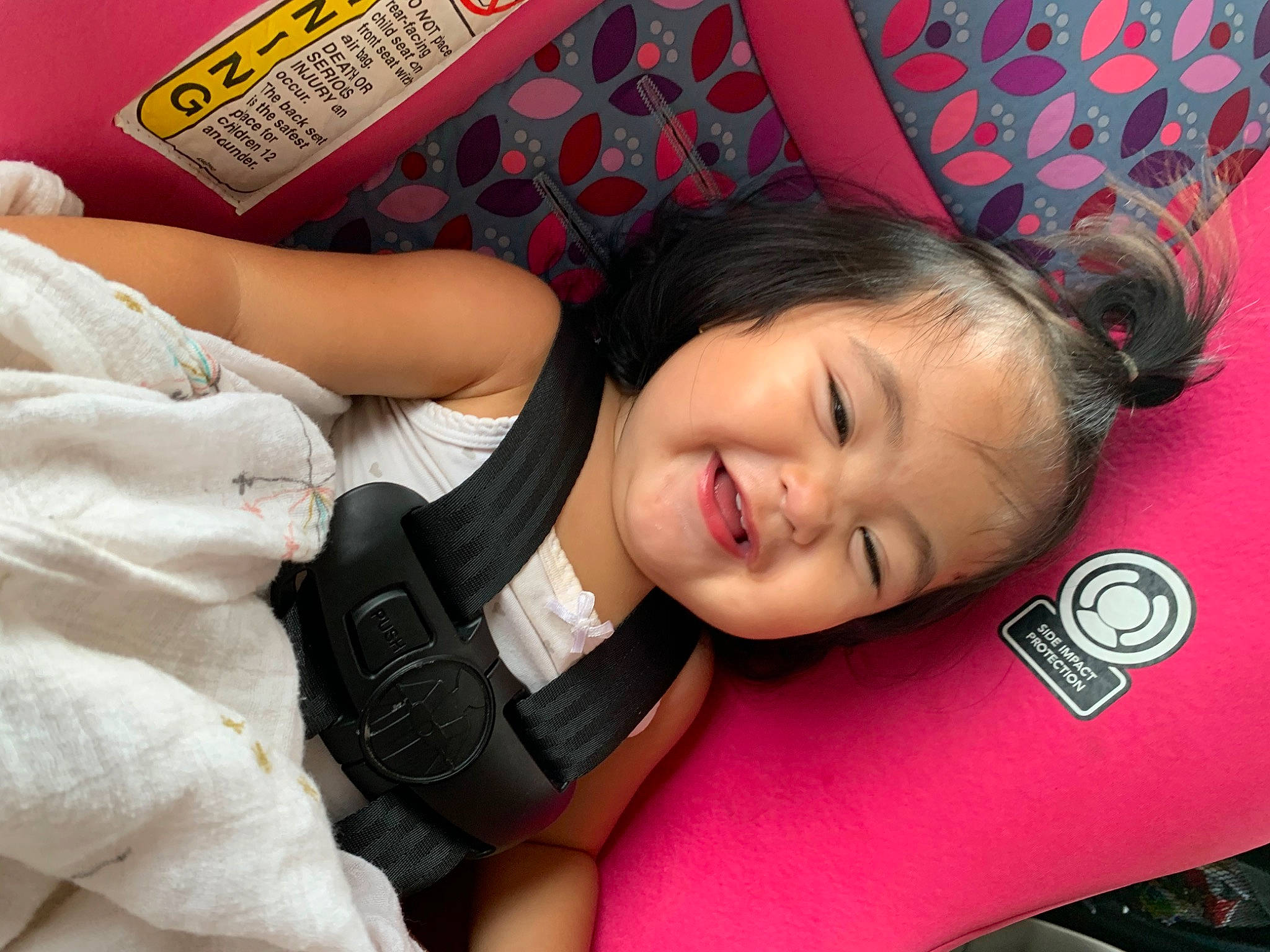 Keatyn is registered to the contest to win money with this photo: arm, baby, black_hair, cheek, child, leg, material_property, mouth, nap, neck, nose, person, pink, plant, play, skin, sleep, toddler, vacation