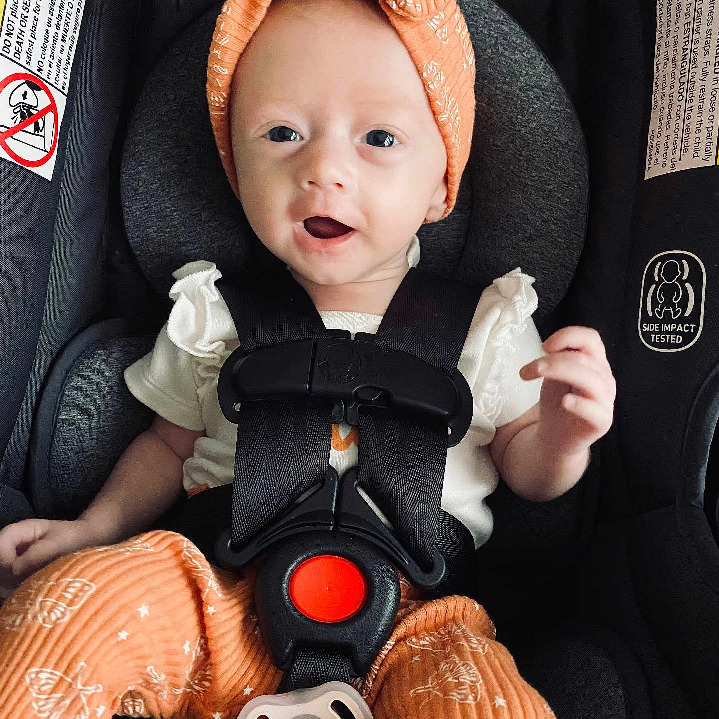 Nora joined the competition — help win amazing prizes! baby, babylaughing, bonnet, car, car_interior, carseat, clothing, coat, face, happy, hat, head, person, photography, portrait, sitting, smile, transportation, vehicle, yawning
