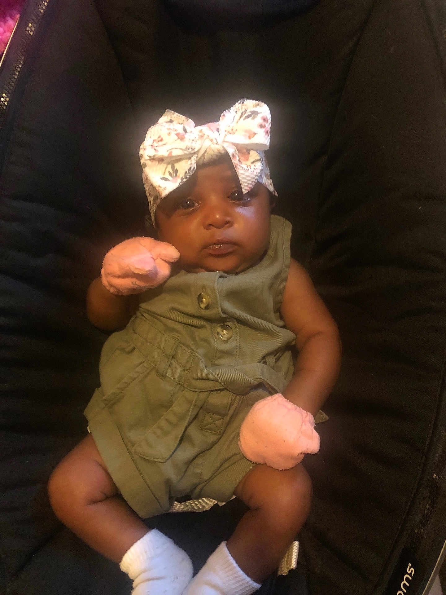 Jakiya joined the competition — help win amazing prizes! adorable, baby, baby_girl, black_seat, child, clothing, cute, fashion, green_outfit, headband, indoor, infant, mittens, person, portrait, seated, small, soft_lighting, white_socks, young