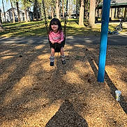 Inari joined the competition — help win amazing prizes! bicycle, blue_pole, boots, child, daytime, fun, grass, house, nature, outdoor, park, person, pink_shirt, playground, shadow, smiling, sunlight, swing, trees, woodchips