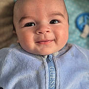 Kenan participe au concours pour gagner de l'argent avec cette photo : baby, infant, smiling, face, eyes, cheeks, onesie, zipper, clothing, blue, blanket, toy, pacifier, close_up, portrait, skin, head, eyelashes, adorable, background_blur