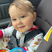 Nehemiah joined the competition — help win amazing prizes! baby, child, car_seat, pajamas, toy, cup, smile, face, seatbelt, car_interior, infant, child_seat, colorful_clothing, cute, rosy_cheeks, safety_harness, indoor, closeup, happy, young_child