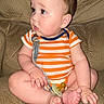 Nehemiah joined the competition — help win amazing prizes! baby, child, closeup, couch, curious, cute, face, foot, furniture, hand, indoors, infant, onesie, pacifier, plump, portrait, sitting, skin, soft_texture, striped_clothing