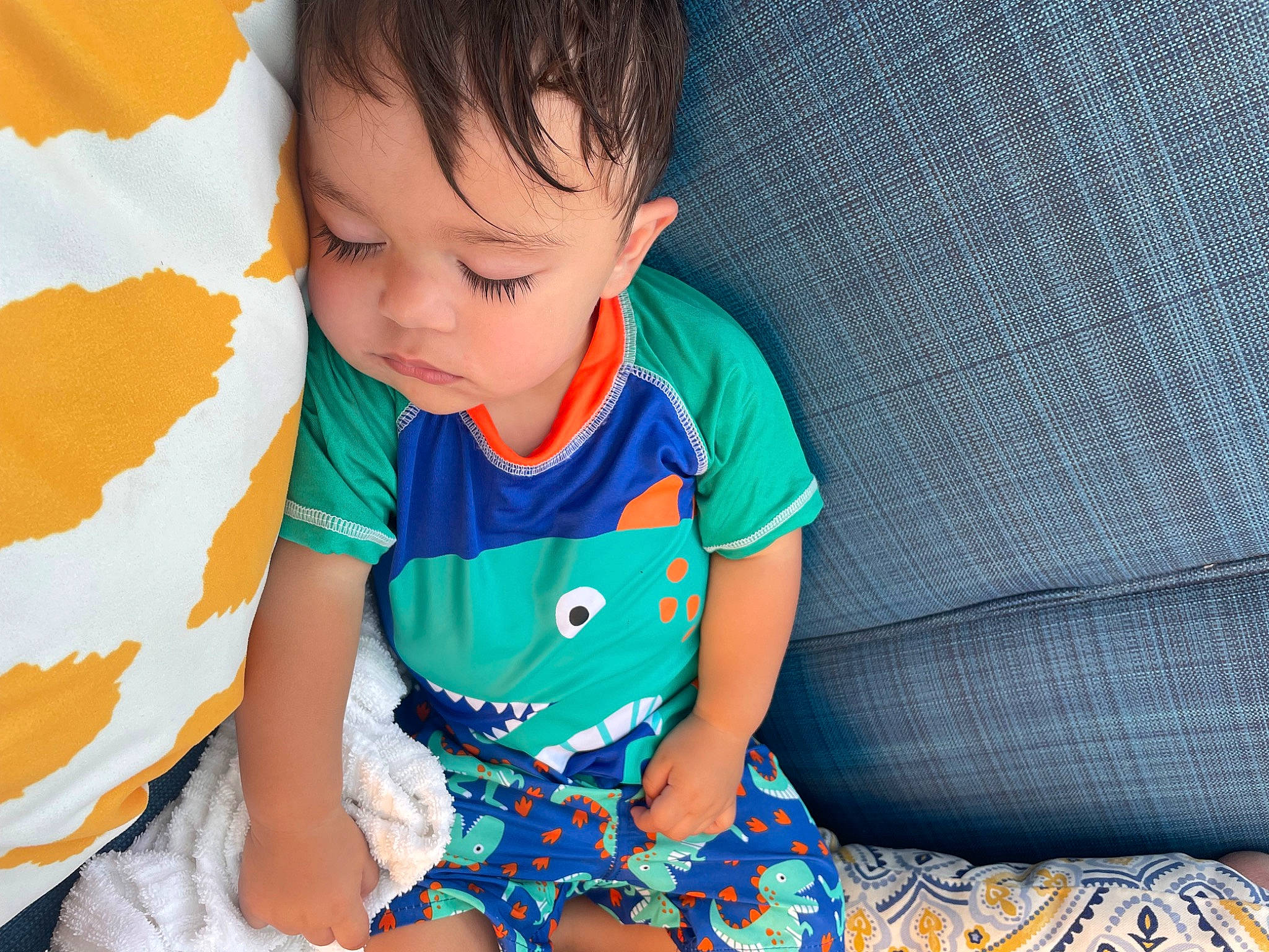 Eddie is registered to the contest to win money with this photo: baby, baby_products, baby_toddler_clothing, child, comfort, electric_blue, finger, grass, hand, happy, human_body, linens, pattern, person, play, sitting, skin, sleeve, t_shirt, textile