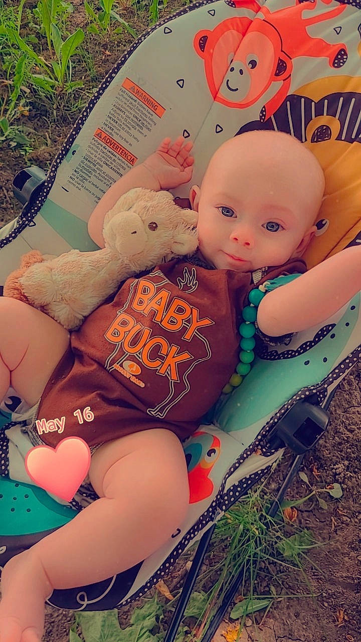 Alexander is registered to the contest to win money with this photo: abdomen, baby_products, baby_toddler_clothing, child, doll, fashion_accessory, grass, happy, human_leg, love, pattern, person, pink, plush, sitting, skin, stuffed_toy, teddy_bear, textile, thigh