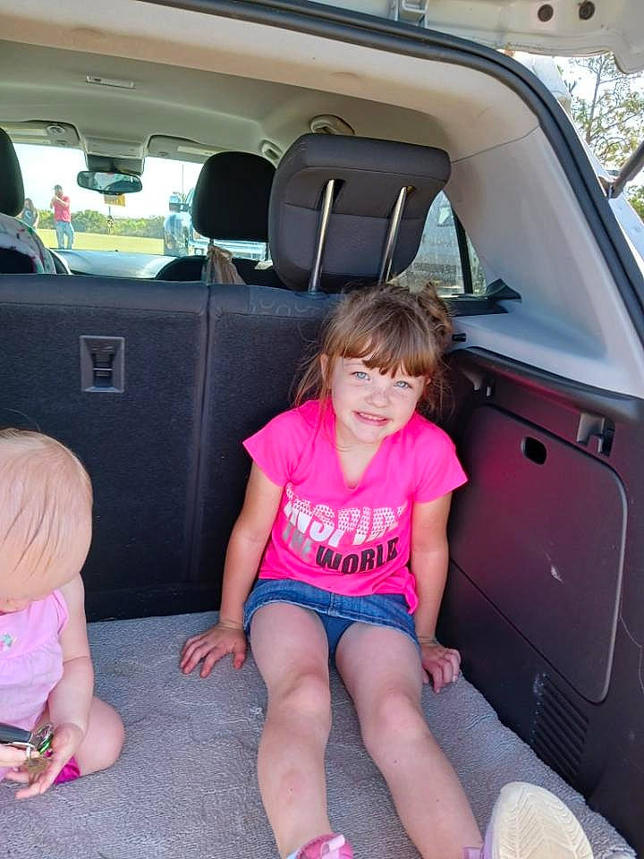 Jalynn is registered to the contest to win money with this photo: automotive_design, automotive_exterior, bumper, car, car_seat, car_seat_cover, fun, hood, joy, leg, leisure, motor_vehicle, person, pink, shorts, smile, summer, thigh, trunk, vehicle