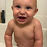 Jackson joined the competition — help win amazing prizes! baby, child, bathtub, bathroom, smiling, laughing, portrait, indoor, water, wet, tub, infant, blue_eyes, bare_shoulders, happy, sitting, face, hands, family_photo, close_up