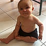 Tiago a rejoint le concours — aidez-le/la à gagner de superbes lots ! arm, baby, chair, child, cute, floor, furniture, happy, head, indoor, infant, legs, person, room, shorts, sitting, skin, smile, tile, wood